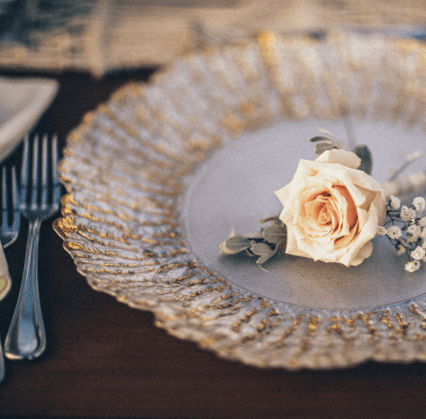 gold embellished plate and silver cutlery close up, wedding decor